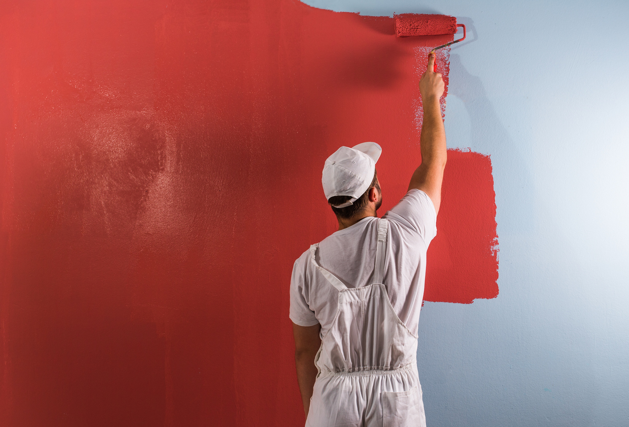 Painter using a roller to paint a wall in Livermore, CA