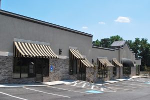 Commercial store fronts in Dublin with existing awnings