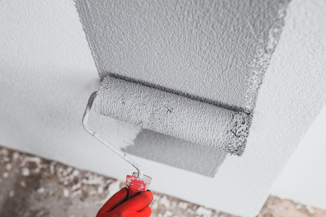 Applying paint with a paint roller in the Bay Area