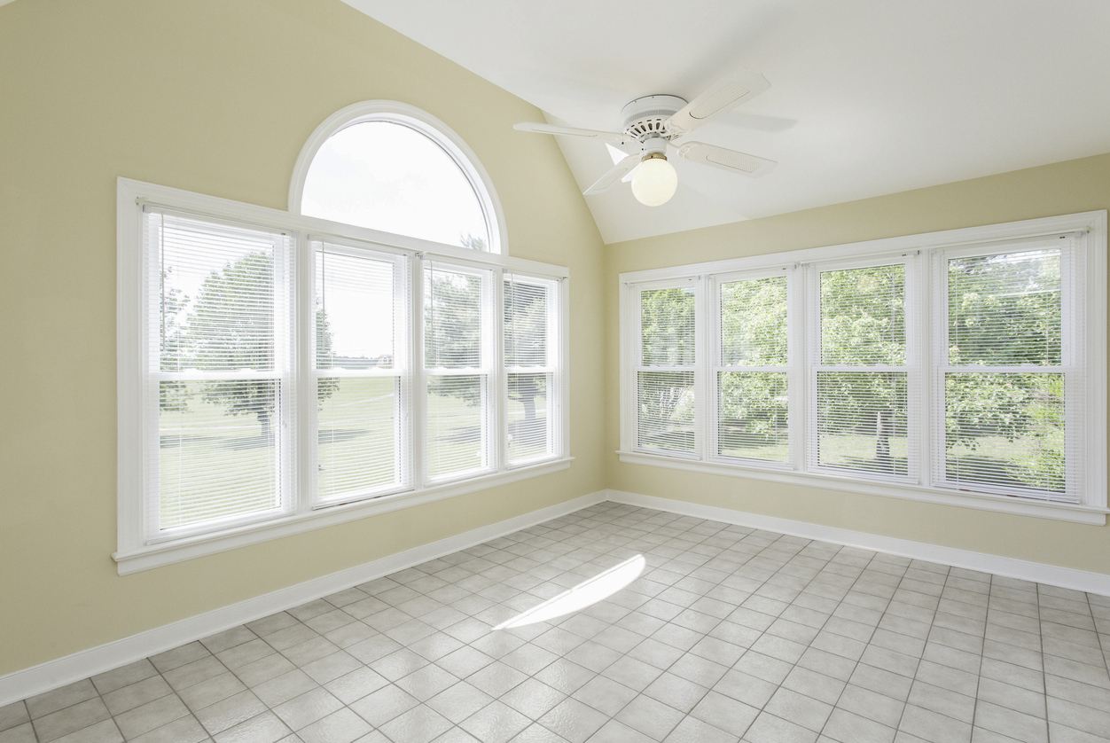 Bright Sunroom Interior With Large Windows And Abundant Natural Light